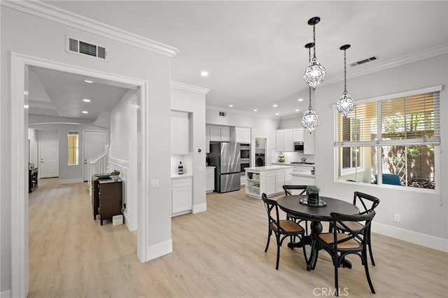 18 Beacon, Ladera Ranch, CA 92694 - dining room with crown molding, light wood-style flooring, and recessed lighting