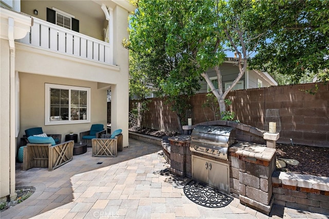 18 Beacon, Ladera Ranch, CA 92694 - patio / terrace featuring a fenced backyard, exterior kitchen, and a patio