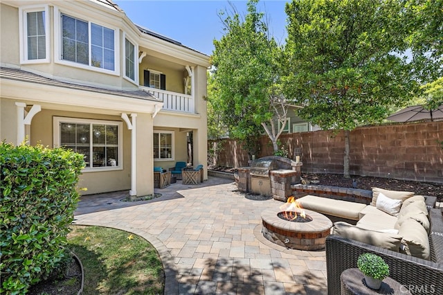 18 Beacon, Ladera Ranch, CA 92694 - patio / terrace featuring an outdoor living space with a fire pit, a patio area, and an outdoor kitchen