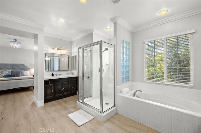 18 Beacon, Ladera Ranch, CA 92694 - full bathroom with a bath, wood finished floors, vanity, and a shower stall