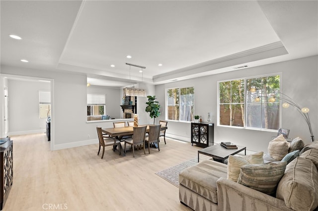 18 Beacon, Ladera Ranch, CA 92694 - living area featuring a tray ceiling, light wood-type flooring, and recessed lighting