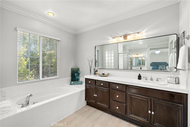 18 Beacon, Ladera Ranch, CA 92694 - full bathroom with vanity, a bath, ornamental molding, and wood finished floors