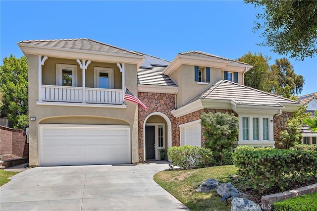 18 Beacon, Ladera Ranch, CA 92694 - view of front of house with stone siding, a balcony, and stucco siding