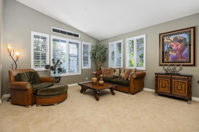 1034 Via Reata, Vista, CA 92081 - living area with lofted ceiling, carpet flooring, and baseboards