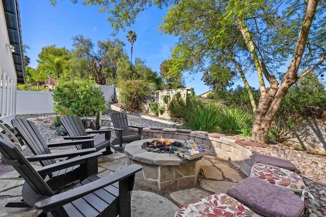 1034 Via Reata, Vista, CA 92081 - view of patio featuring a fire pit and a fenced backyard