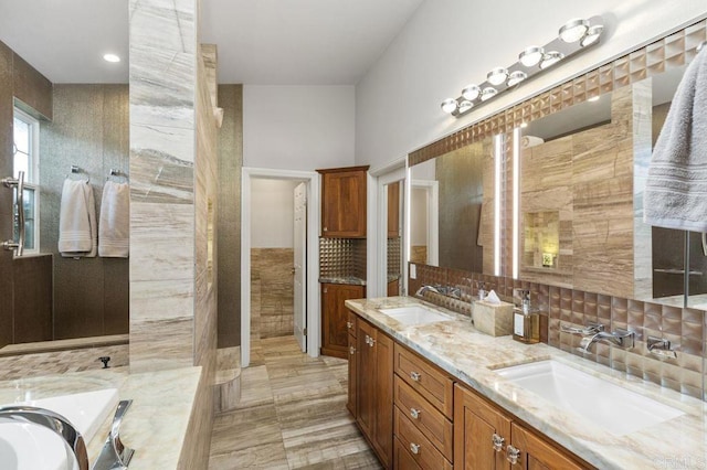 1034 Via Reata, Vista, CA 92081 - bathroom featuring backsplash, double vanity, and a sink