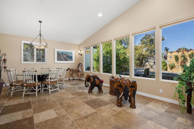 1034 Via Reata, Vista, CA 92081 - dining space featuring recessed lighting, stone tile flooring, lofted ceiling, and baseboards
