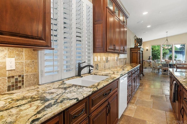 1034 Via Reata, Vista, CA 92081 - kitchen featuring stone tile floors, dishwasher, a sink, and tasteful backsplash