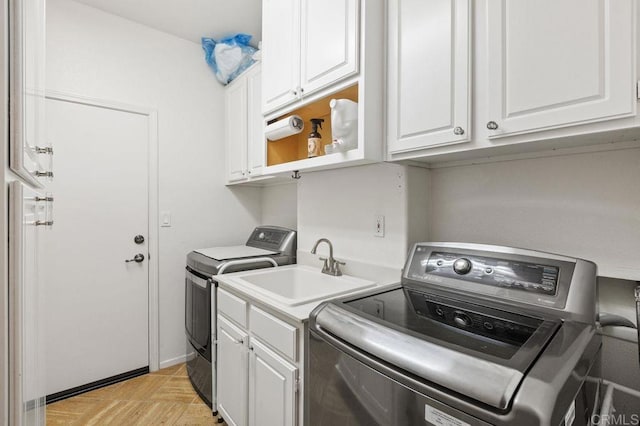 1034 Via Reata, Vista, CA 92081 - laundry room with washer and dryer, cabinet space, and a sink