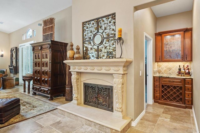 1034 Via Reata, Vista, CA 92081 - interior space featuring visible vents, stone finish floor, and a fireplace with raised hearth
