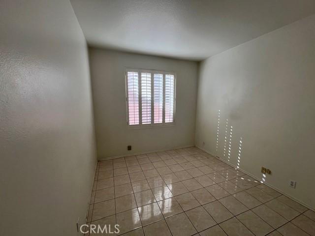 spare room with light tile patterned floors