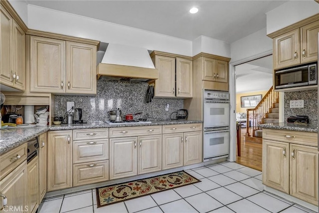 4612 Wolfe Way, Woodland Hills, CA 91364 - kitchen featuring custom exhaust hood, built in microwave, double oven, decorative backsplash, and gas stovetop