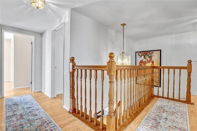 4612 Wolfe Way, Woodland Hills, CA 91364 - corridor featuring an upstairs landing, wood finished floors, and baseboards