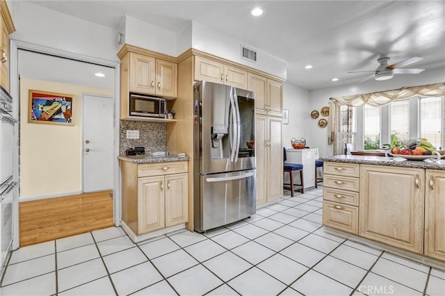 4612 Wolfe Way, Woodland Hills, CA 91364 - kitchen with stainless steel appliances, light brown cabinets, ceiling fan, light tile patterned floors, and recessed lighting