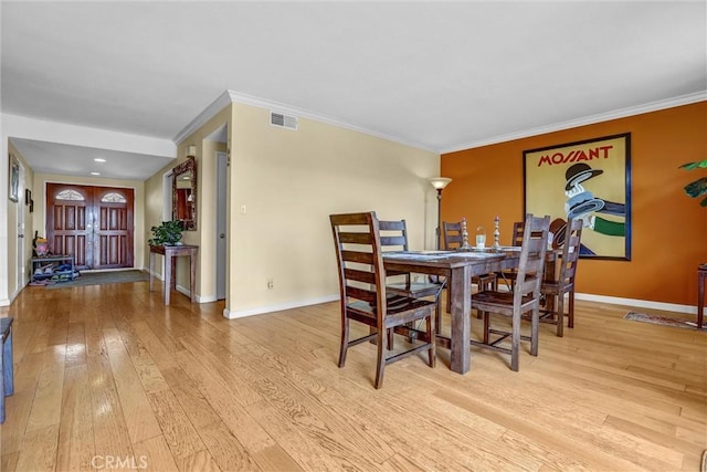 4612 Wolfe Way, Woodland Hills, CA 91364 - dining area featuring hardwood / wood-style flooring, baseboards, and ornamental molding