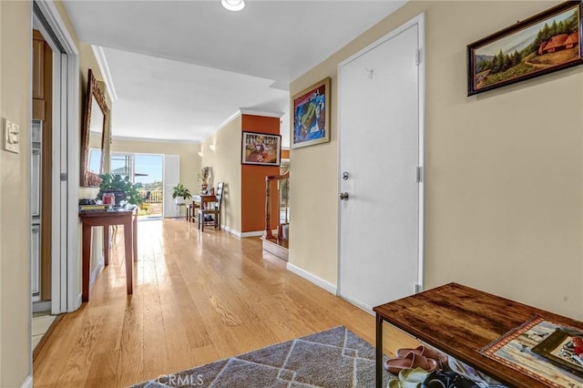 4612 Wolfe Way, Woodland Hills, CA 91364 - corridor with light wood-type flooring, baseboards, and ornamental molding