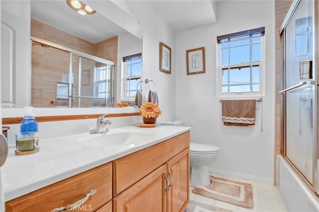 4612 Wolfe Way, Woodland Hills, CA 91364 - bathroom with vanity, toilet, baseboards, combined bath / shower with glass door, and tile patterned flooring