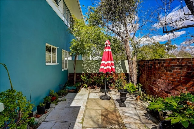 view of patio with fence