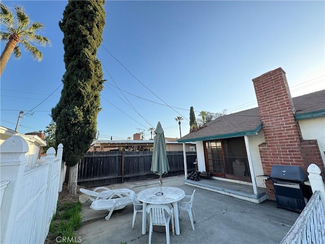 view of patio featuring a grill and fence private yard