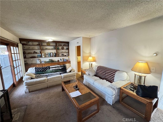 carpeted living area with a textured ceiling