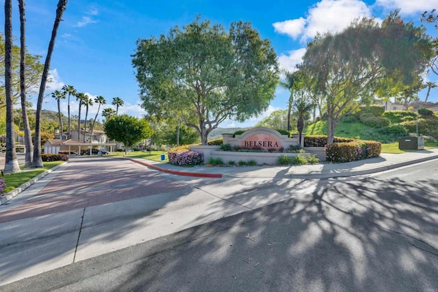 view of street with sidewalks and curbs
