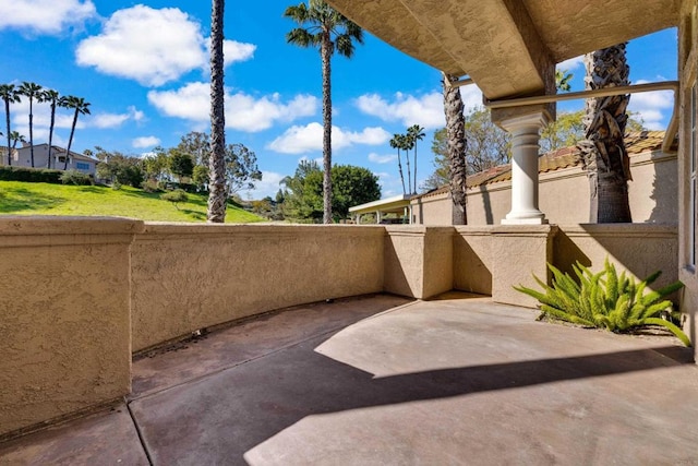 view of patio featuring a balcony