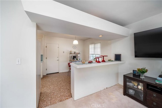 kitchen with pendant lighting and a peninsula