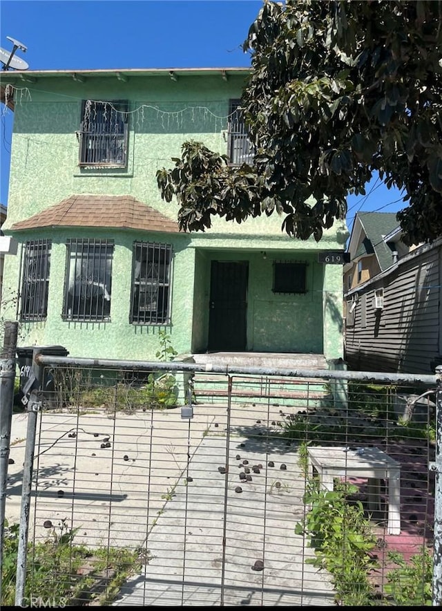619 E 22nd St, Los Angeles, CA 90011 - view of front of house featuring stucco siding and fence