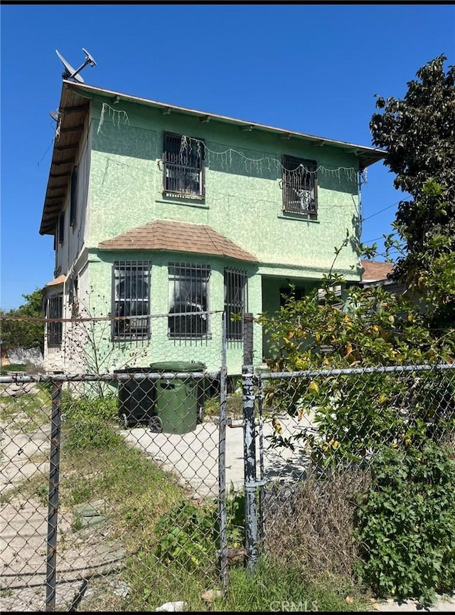 619 E 22nd St, Los Angeles, CA 90011 - view of front of house with stucco siding and fence
