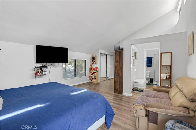 1799 Betty St, Wrightwood, CA 92397 - bedroom featuring wood finished floors, baseboards, lofted ceiling, and ensuite bath