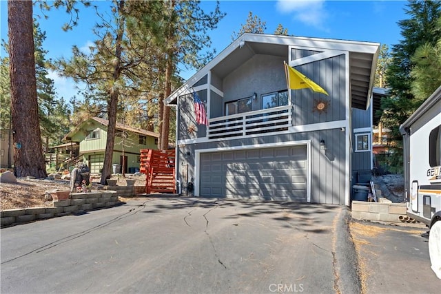 1799 Betty St, Wrightwood, CA 92397 - view of front facade with stairway, a garage, driveway, and a balcony