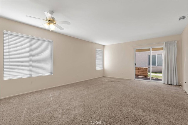 19071 Stoddard Way, Apple Valley, CA 92308 - carpeted empty room featuring a ceiling fan and plenty of natural light