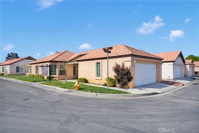 19071 Stoddard Way, Apple Valley, CA 92308 - single story home featuring a tile roof, stucco siding, a garage, and driveway