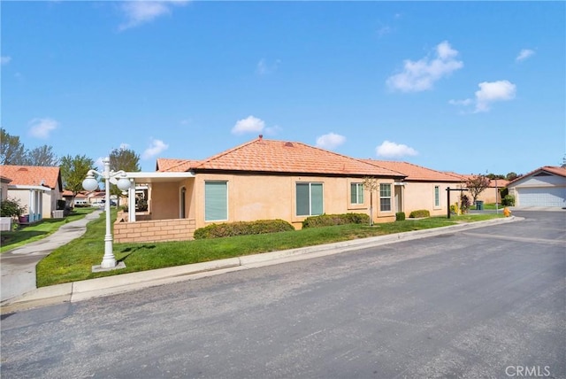 19071 Stoddard Way, Apple Valley, CA 92308 - ranch-style house featuring stucco siding, a tile roof, and a garage