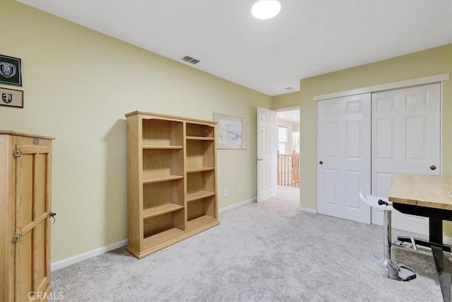 home office featuring visible vents, baseboards, and carpet