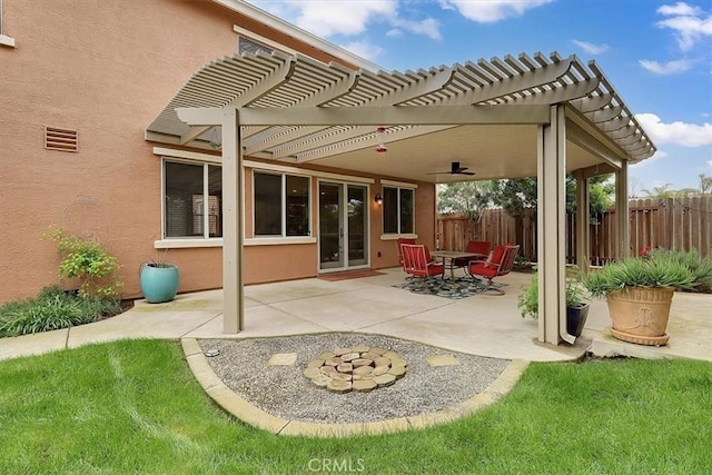 view of patio with a pergola and fence