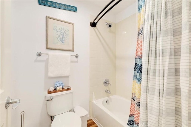 full bathroom with shower / tub combo with curtain and toilet