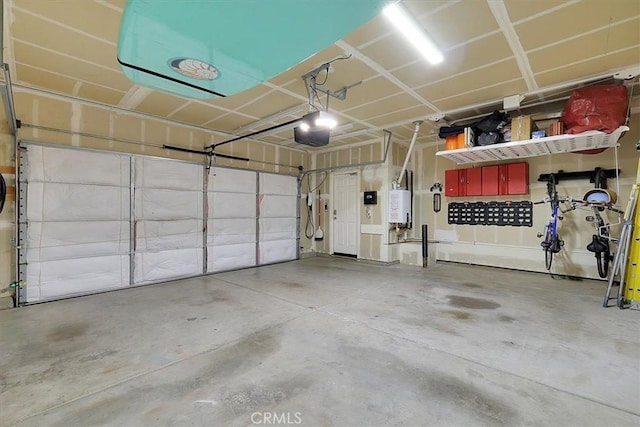 garage featuring water heater and a garage door opener