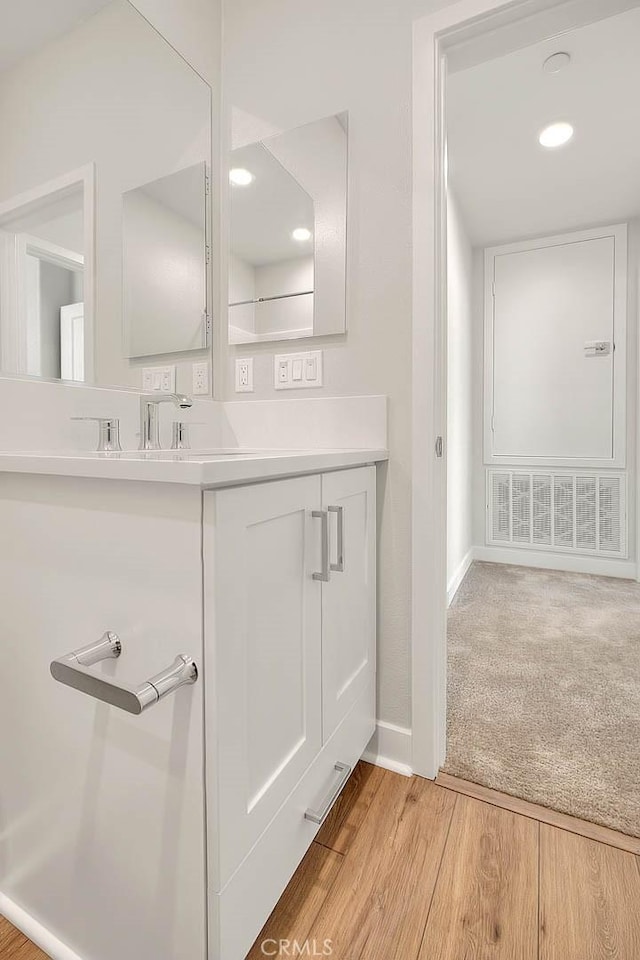 6 Crown Point Dr, Rancho Mission Viejo, CA 92694 - bathroom featuring baseboards, vanity, and wood finished floors