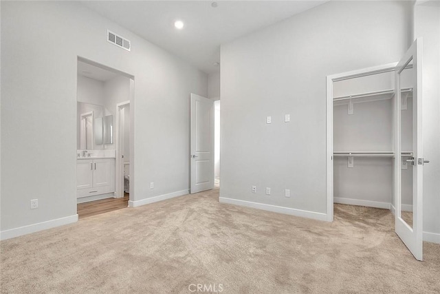 6 Crown Point Dr, Rancho Mission Viejo, CA 92694 - unfurnished bedroom featuring a walk in closet, baseboards, carpet, and visible vents