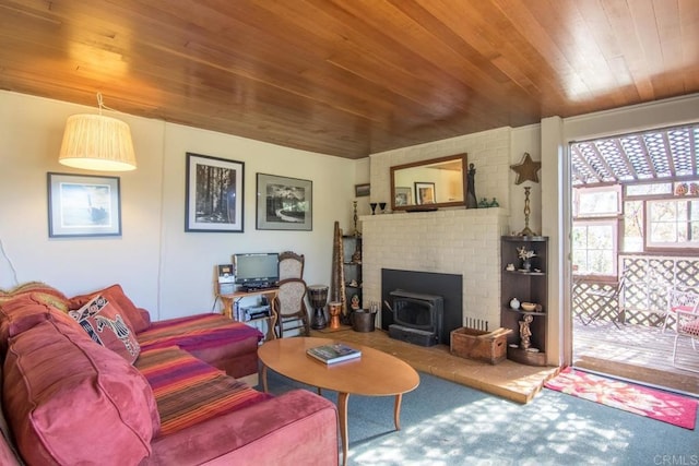 2112 Whispering Pines Dr, Julian, CA 92036 - living room featuring wood ceiling, a wood stove, and carpet