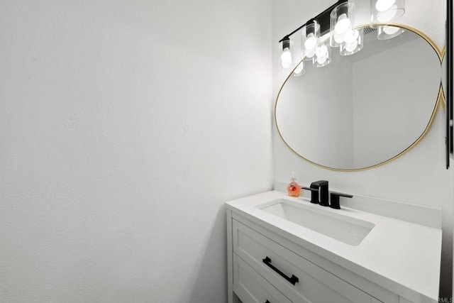 9210 Kenwood Dr Unit J, Spring Valley, CA 91977 - bathroom with vanity and a notable chandelier