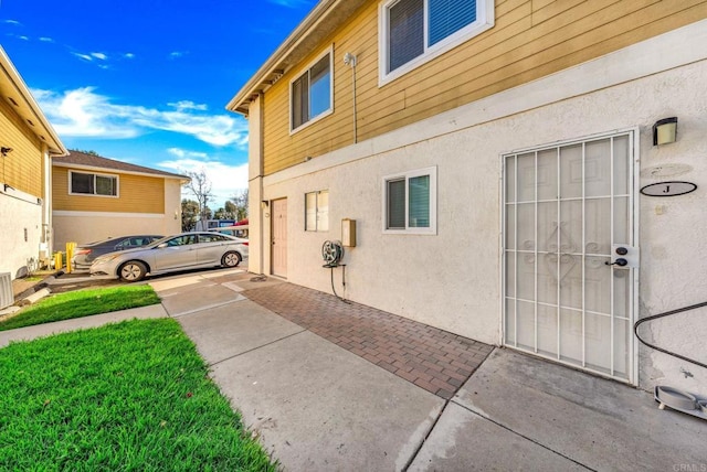 9210 Kenwood Dr Unit J, Spring Valley, CA 91977 - view of property exterior featuring stucco siding