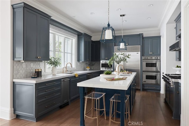 28 Old Course Dr, Newport Beach, CA 92660 - kitchen featuring stainless steel appliances, dark wood-style flooring, light countertops, and crown molding
