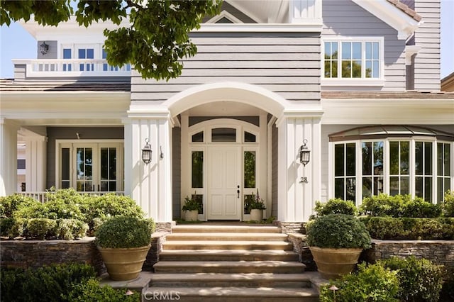 doorway to property featuring board and batten siding