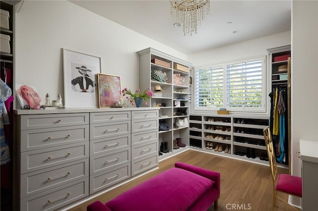 interior space featuring an inviting chandelier and wood finished floors