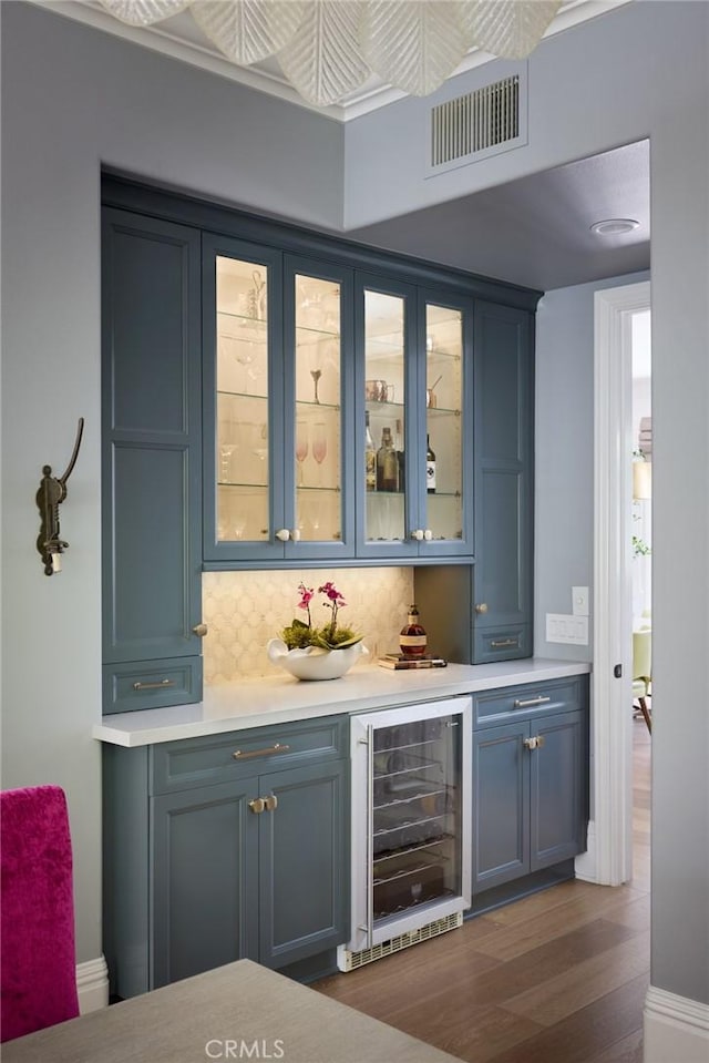 28 Old Course Dr, Newport Beach, CA 92660 - indoor dry bar featuring wine cooler, tasteful backsplash, and dark wood-style floors
