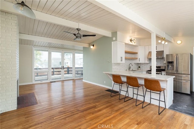 1503 Calle Sacramento, San Clemente, CA 92672 - kitchen with stainless steel appliances, a kitchen breakfast bar, a peninsula, a sink, and tasteful backsplash