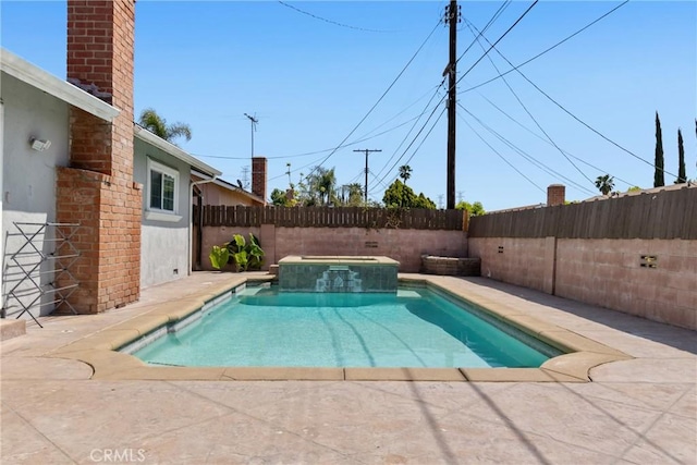 view of swimming pool featuring a patio, a pool with connected hot tub, and a fenced backyard
