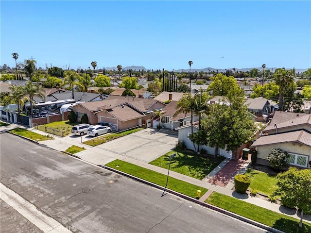 drone / aerial view featuring a residential view and a mountain view